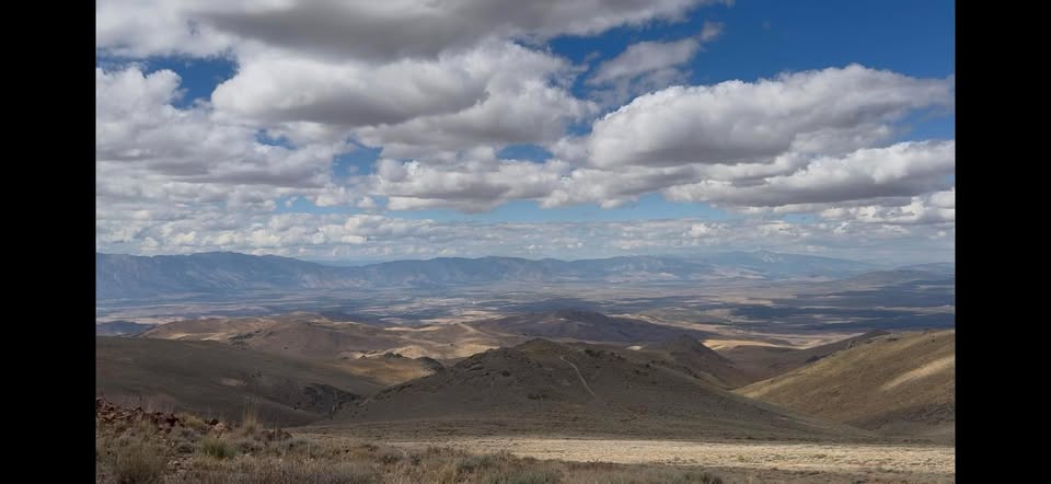 Wide mountain panorama with dramatic clouds