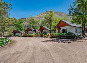 Sierra Retreat cabin-style motel with mountain backdrop in Coleville, CA